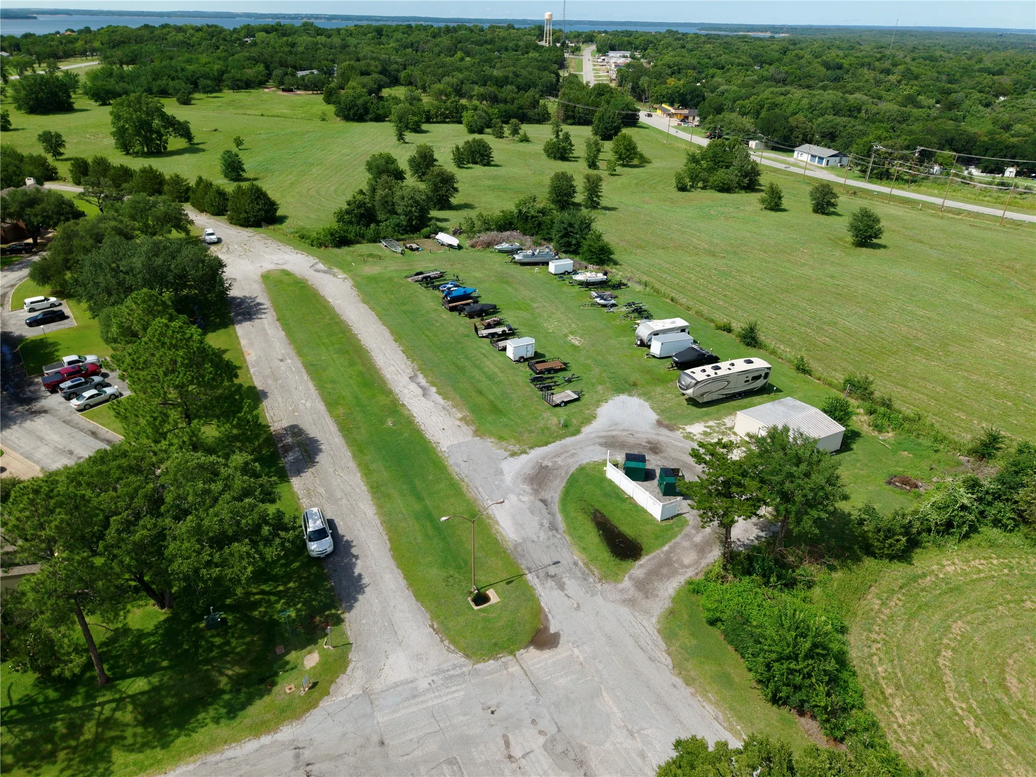 Expansive land parcel with significant green space and distant water body