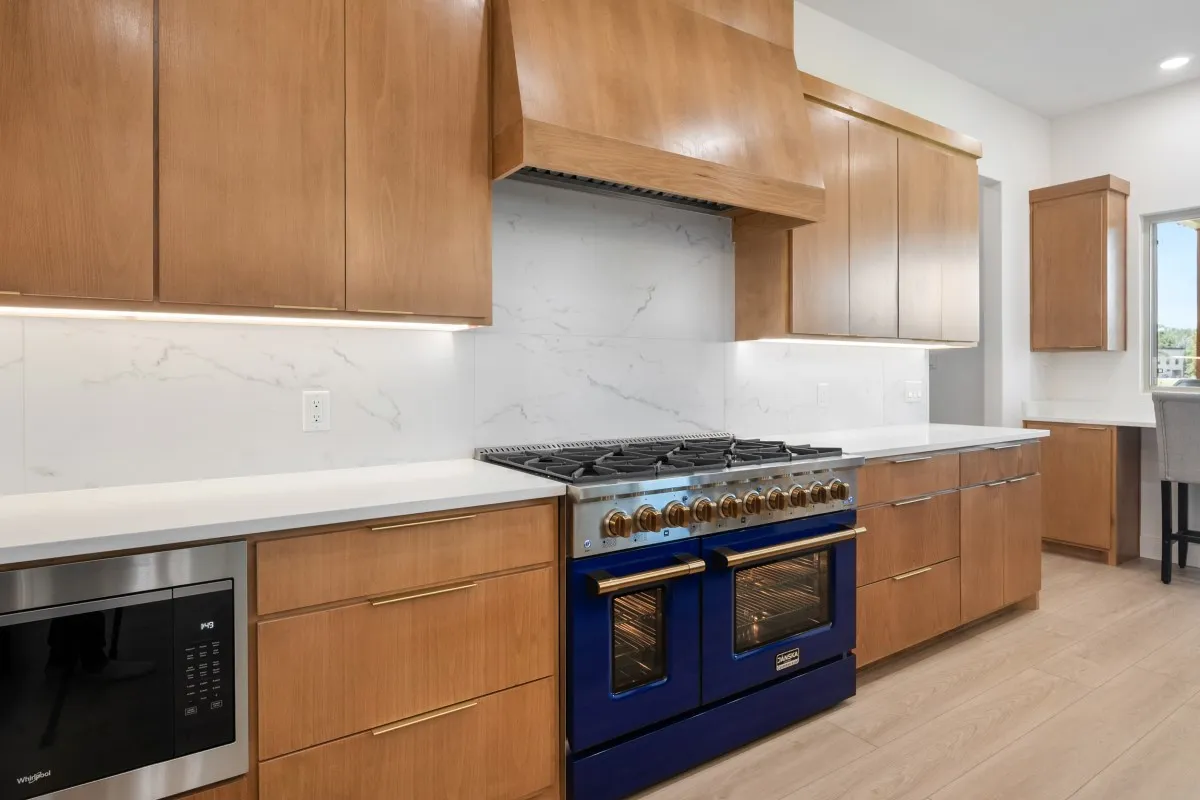 Open-concept living, dining & kitchen with panoramic water views.