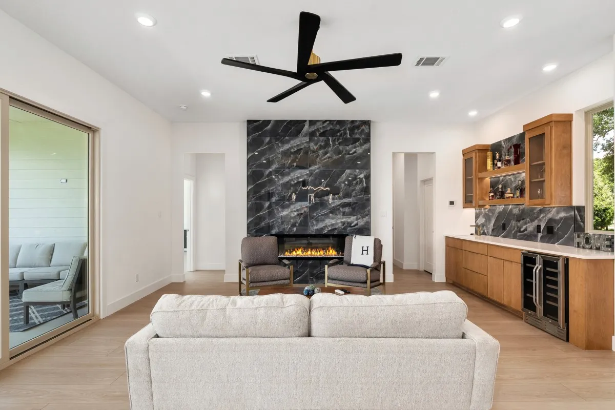 Open-concept living, dining & kitchen with panoramic water views.