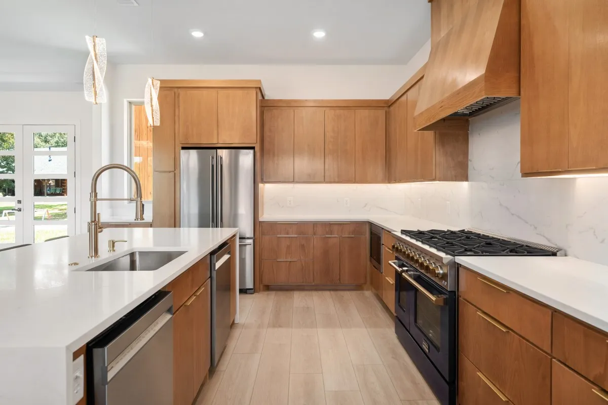 Open-concept living, dining & kitchen with panoramic water views.