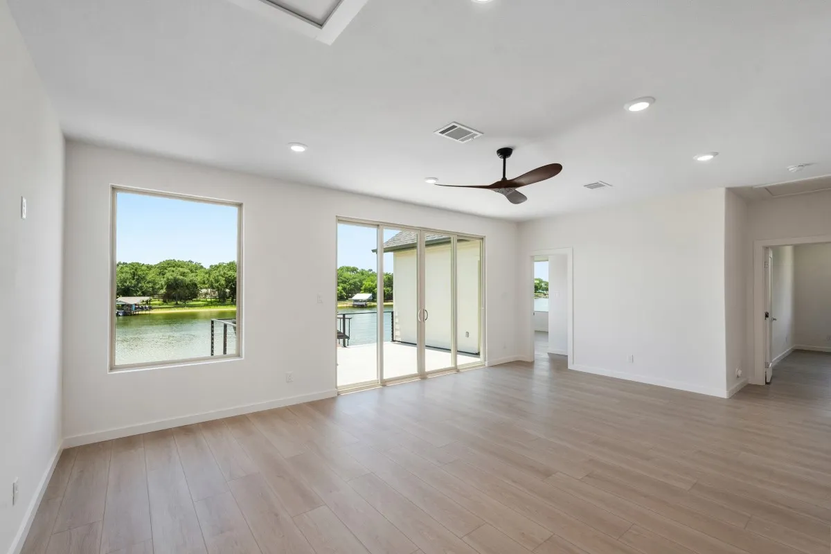 2nd floor family room with water views, patio access, & full bath.