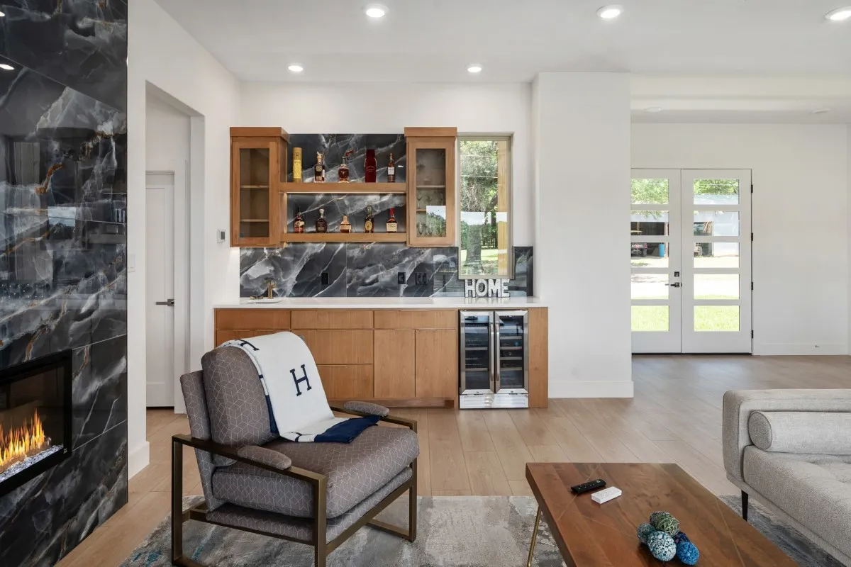 Open-concept living, dining & kitchen with panoramic water views.