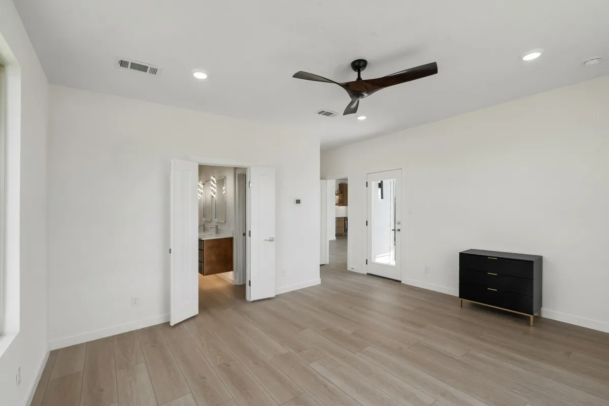 2nd floor water front primary suite with access to patio & large bathroom.