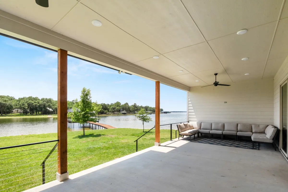 Large covered outdoor patio with kitchen and spacious seating for entertainment.