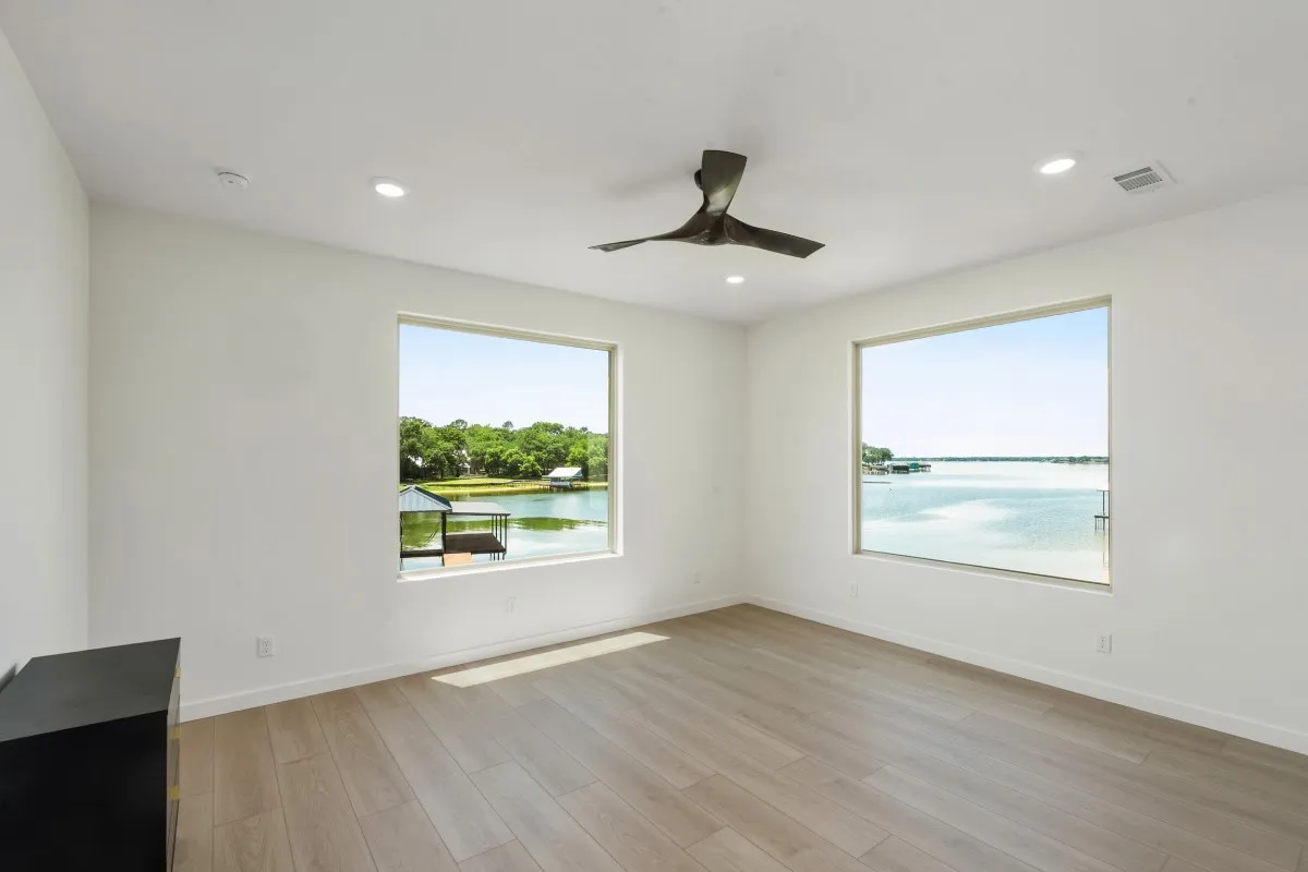 2nd floor water front primary suite with access to patio & large bathroom.