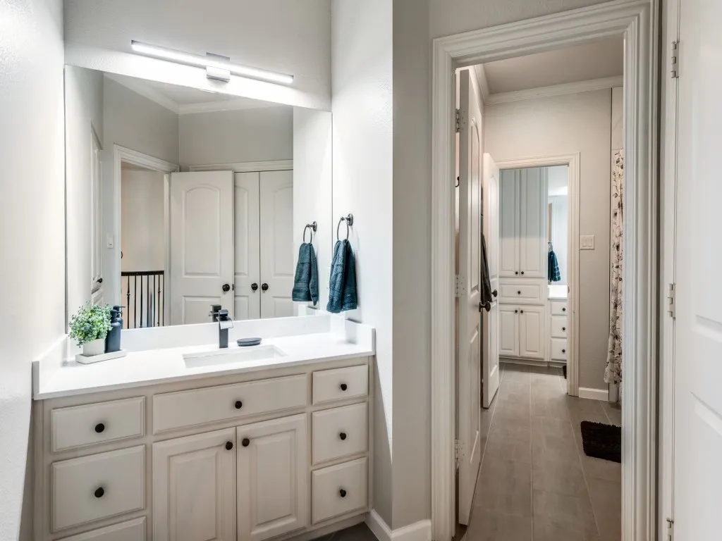 Jack and jill bath with hallway access for guests.