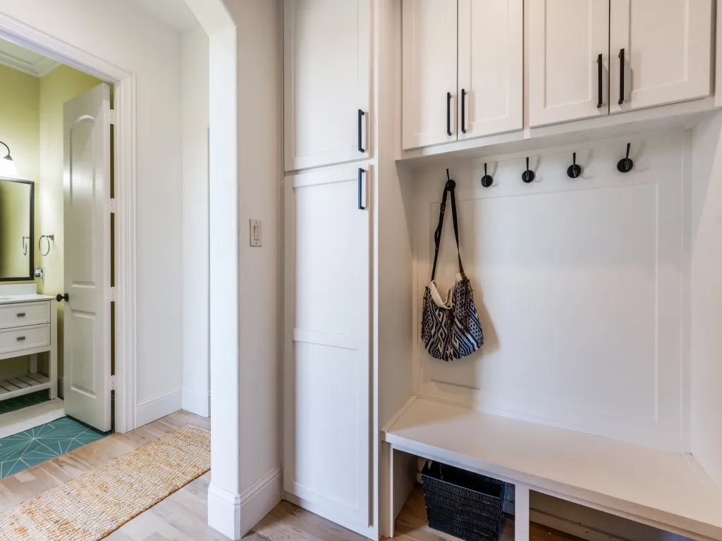 Mudroom off the garage entry plus a second half bath perfect for pool guests.