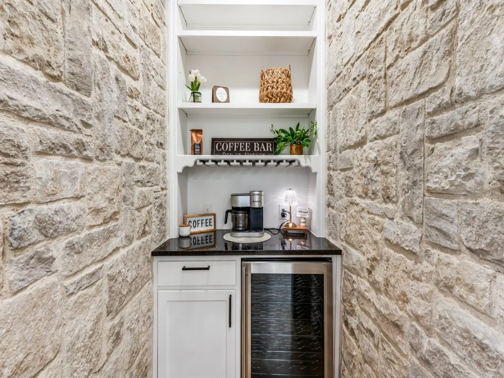 Coffee wine grotto has a wine refrigerator and provides a great space for storage and display.