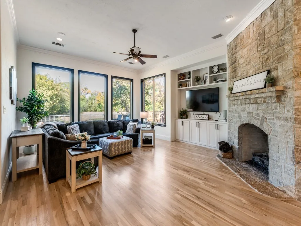 Great built-ins give more storage and updated light wood flooring keeps the space bright.