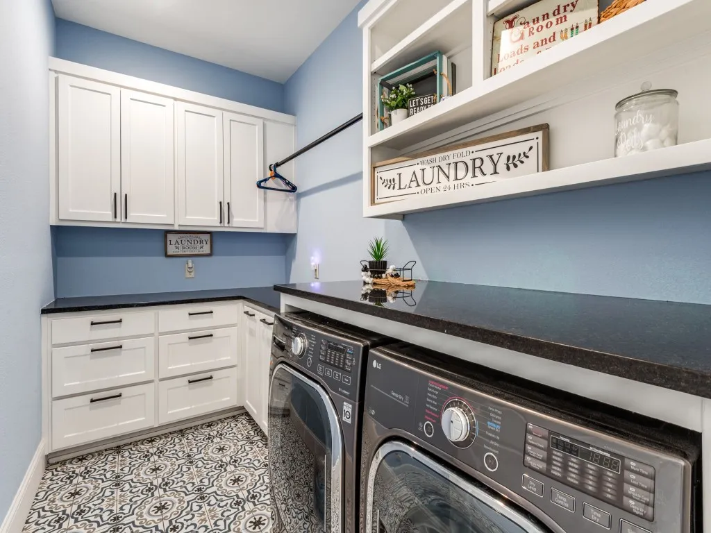 Laundry room features great storage, sorting drawers and folding countertop. Just off garage entry too for a great drop zone.
