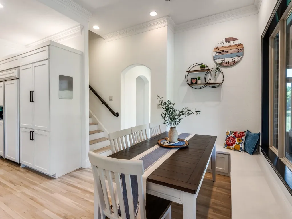Breakfast area has a great bench with more storage for seating plenty and back stairway gives quick access to the kitchen for everyone.