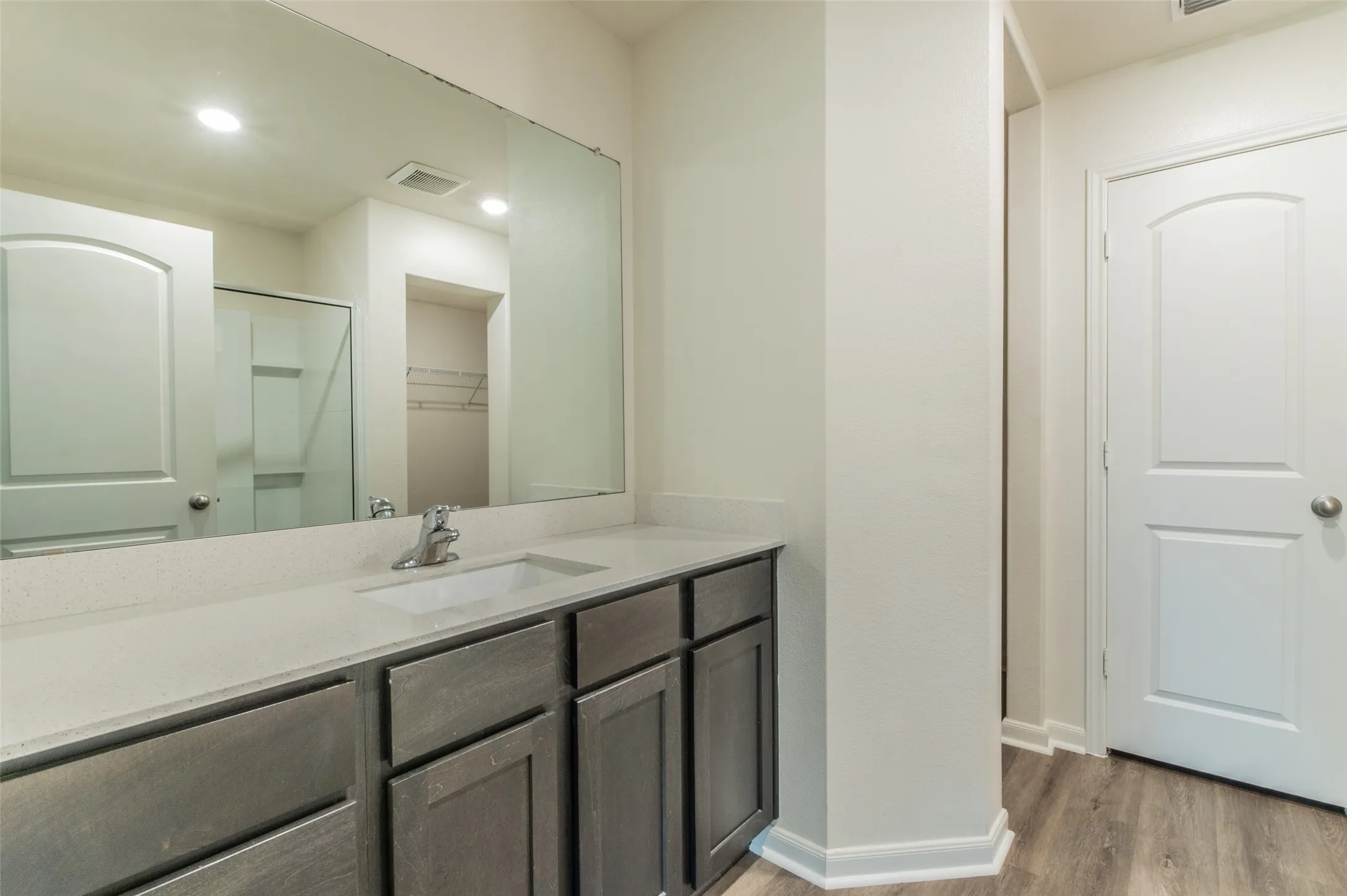Vanity featuring a single undermount sink and a light-toned countertop