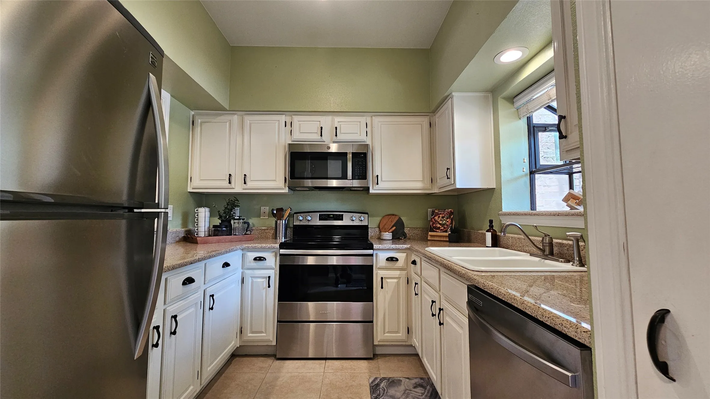 Kitchen with granite countertops and stainless appliances