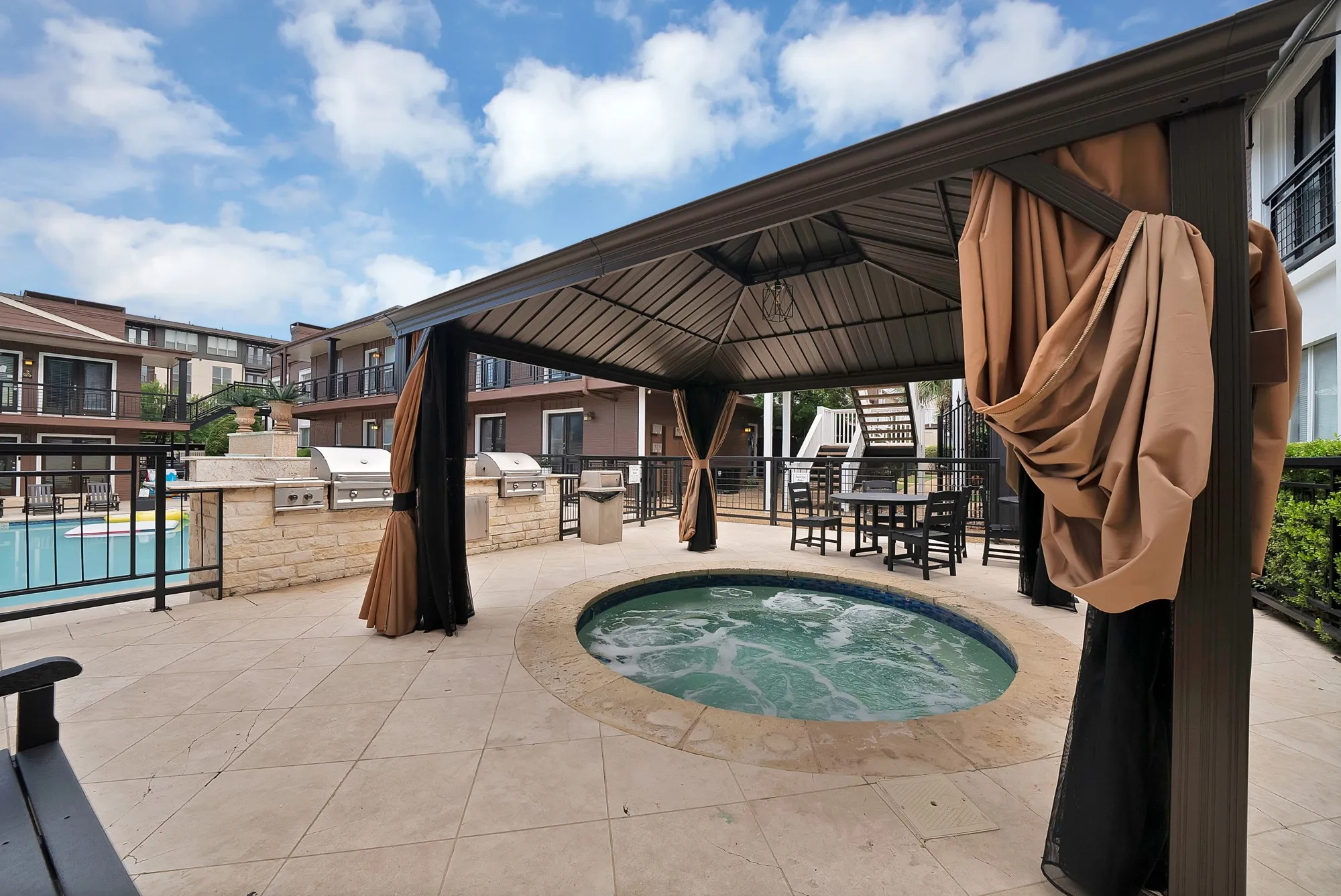 Spa and barbecue grills at the pool