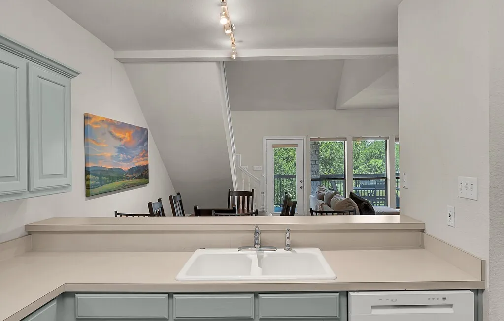 In kitchen looking out to dining and living area.