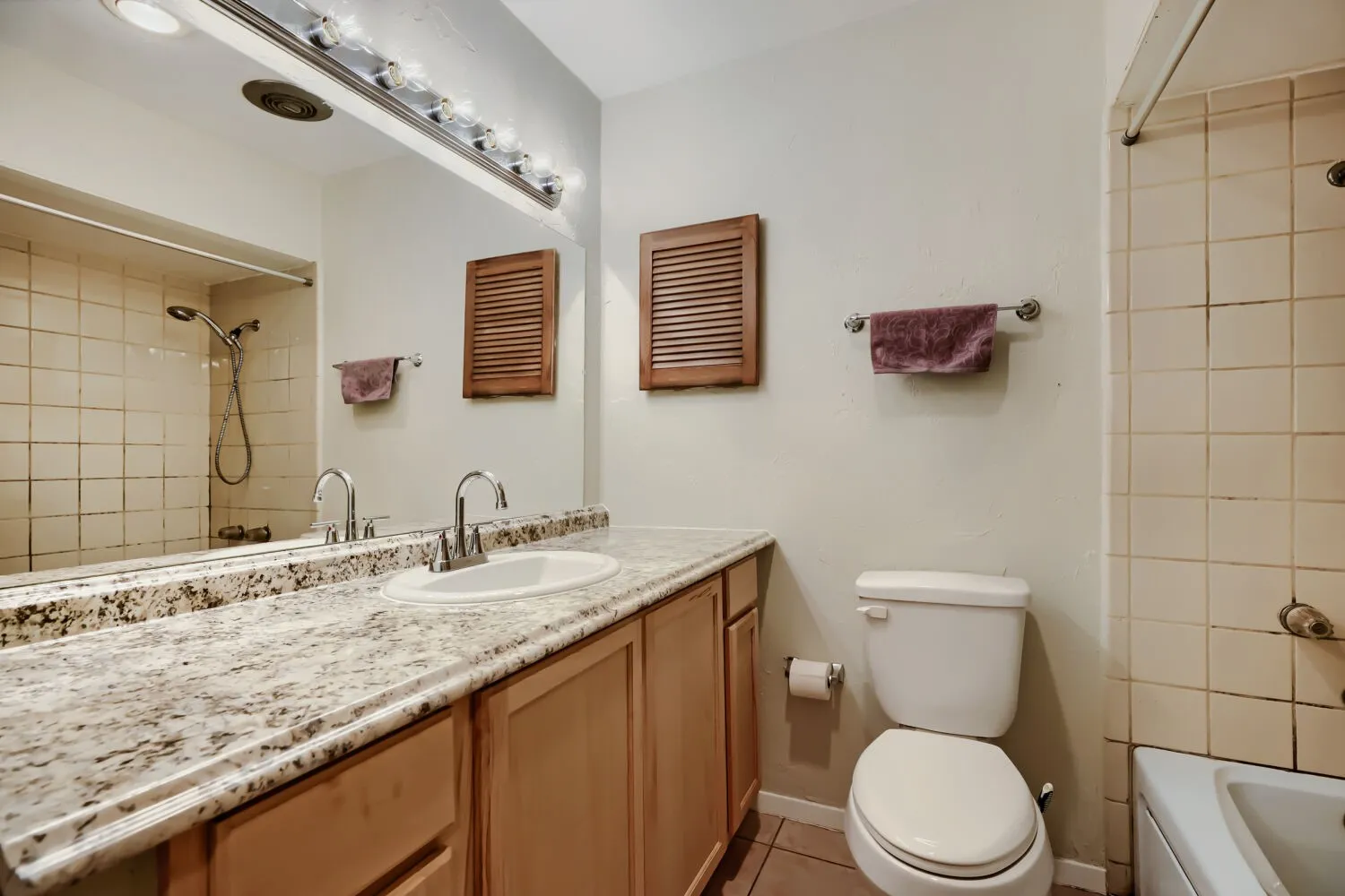 New vanity, sink, mirror and commode.