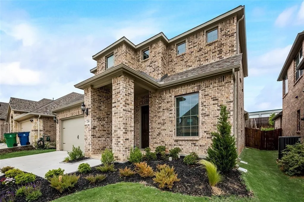 Brick exterior with multiple gables and a covered entry