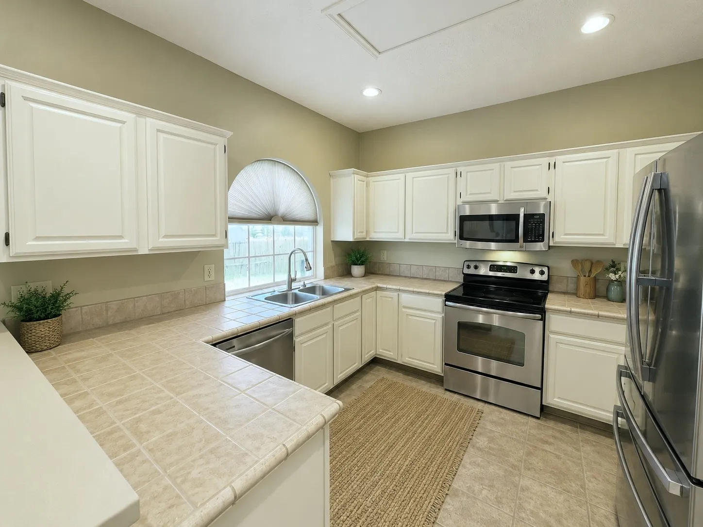 Kitchen has stainless appliances, including microwave, range and dishwasher, currently z.