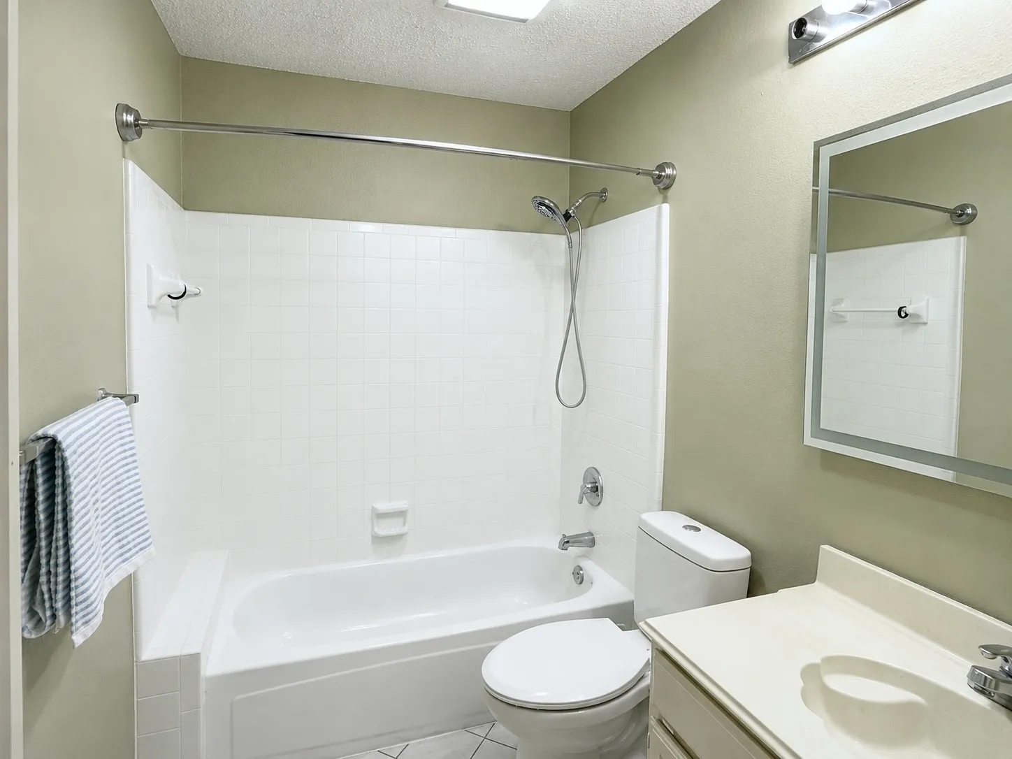 Guest bathroom It’s ready for those active families, tiled tub, surround new toilet mirror with built in factory light, and new electrical, including GFCI. Just walk across the street to Wilson Creek Park and have a nice leisurely day while turning around it a kayak or canoe