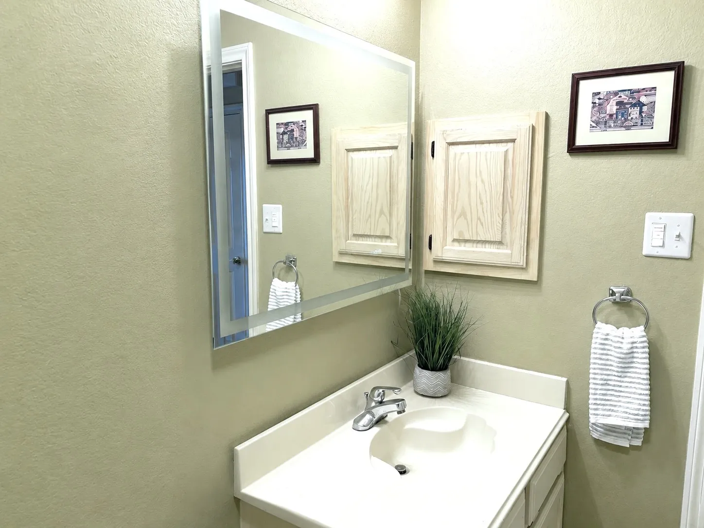 Vanity in Guest bathroom with new toilet and mirror just installed!