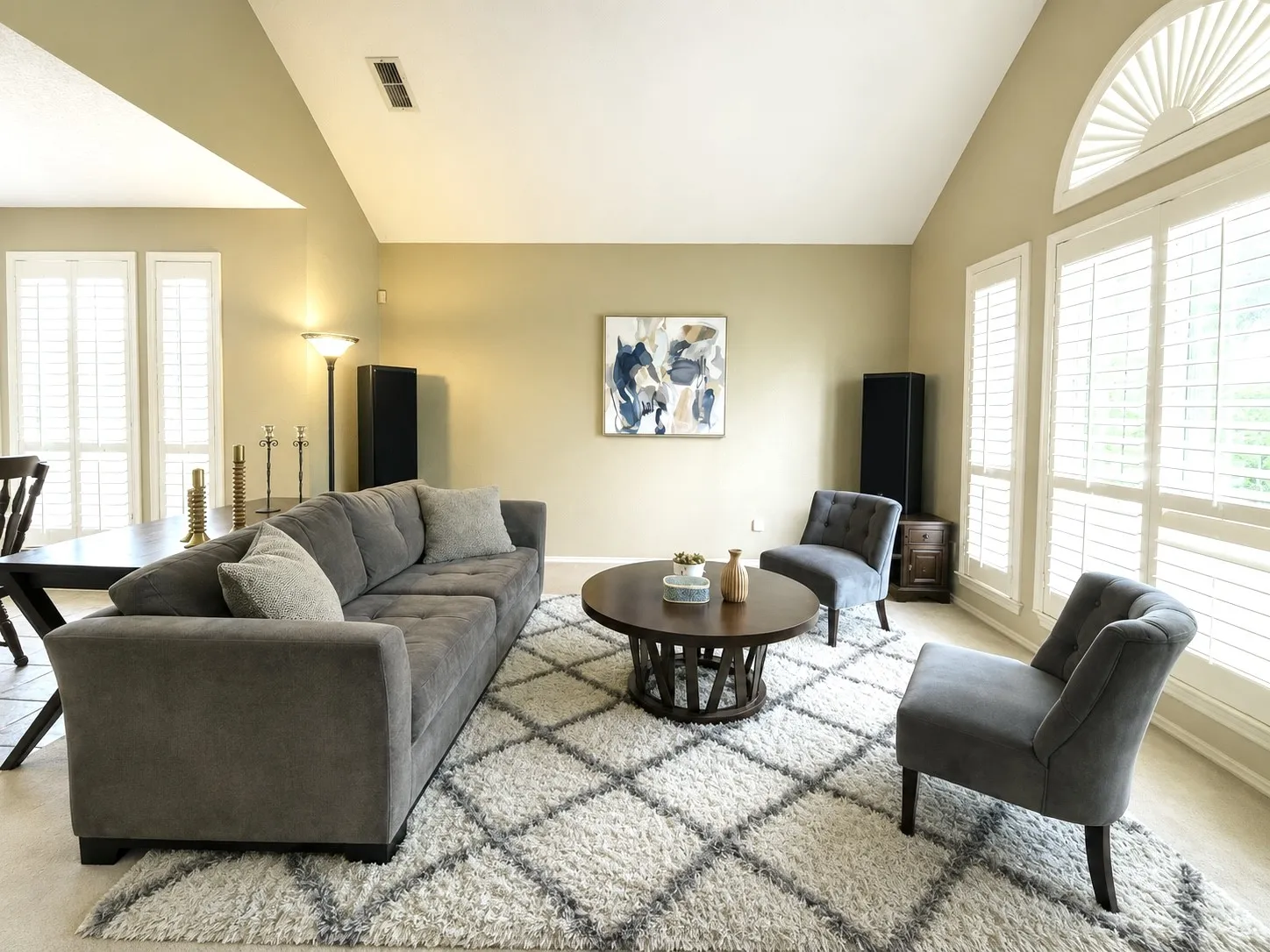 
Sundrenched living room, located just off the foyer features vaulted ceilings and tons of natural light that Flood ends through the huge picture window in the front that is covered with 4 inch wood, plantation shutters! The formal dining room is conveniently nestled between the kitchen and the formal living room, giving amazing flow when entertaining and it features a picture window overlooking Wilson Creek Park and the fountain it’s known for!