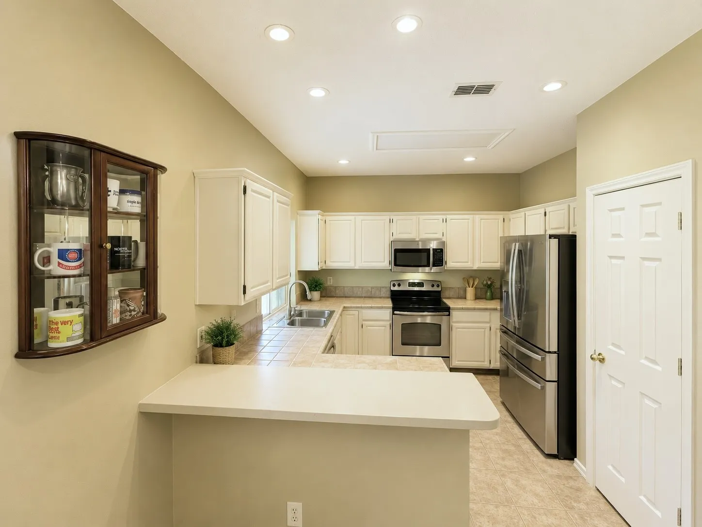 Kitchen features a serving bar to the den and breakfast room and large enough for the family to gather around in the morning for breakfast!