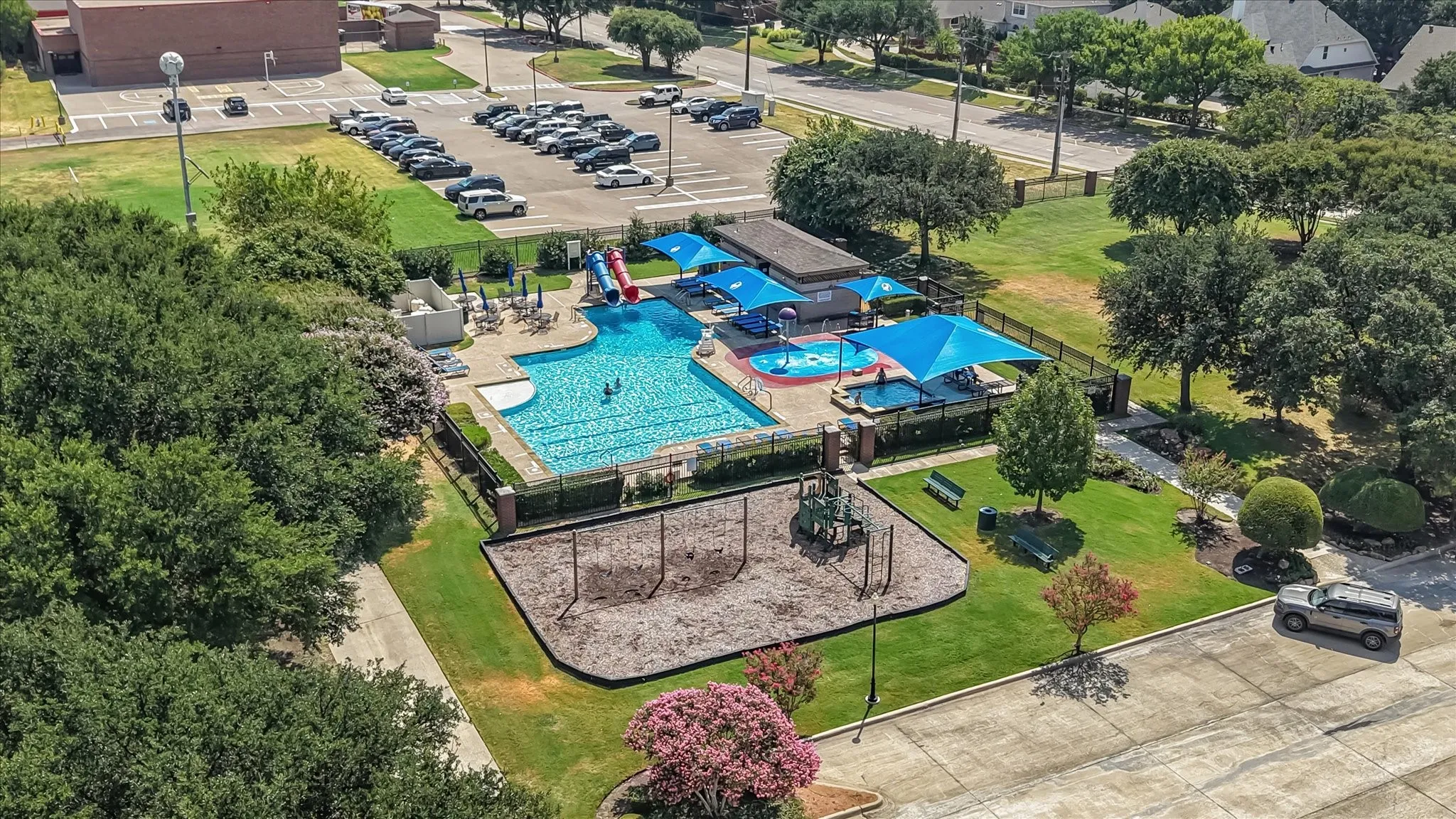 Walk to the Community swimming pool with water slides and shaded lounge areas