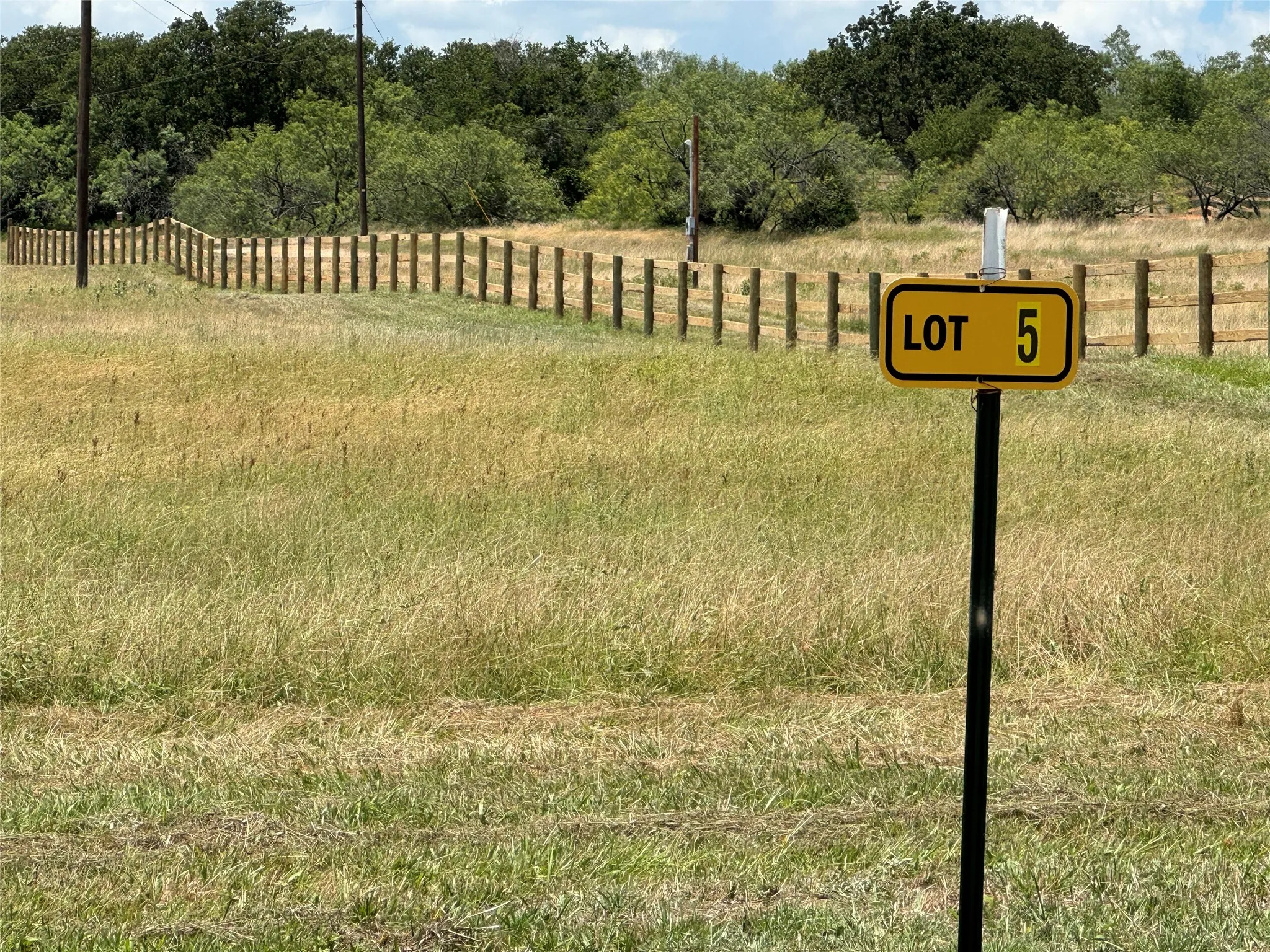 View West across Lot 5 from CR 3735  along the North fence line.