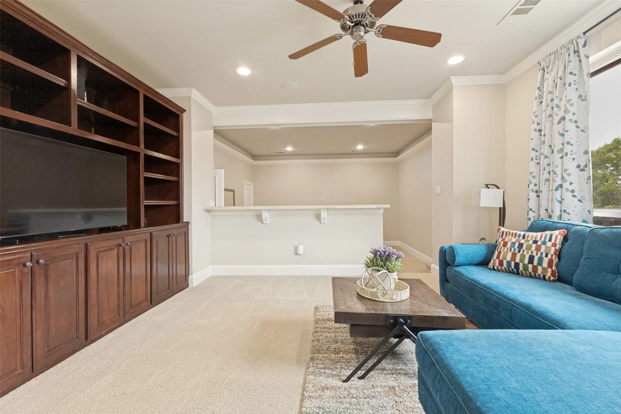 The Game Room is connected to the Media Room, which the seller is currently using as a bedroom.