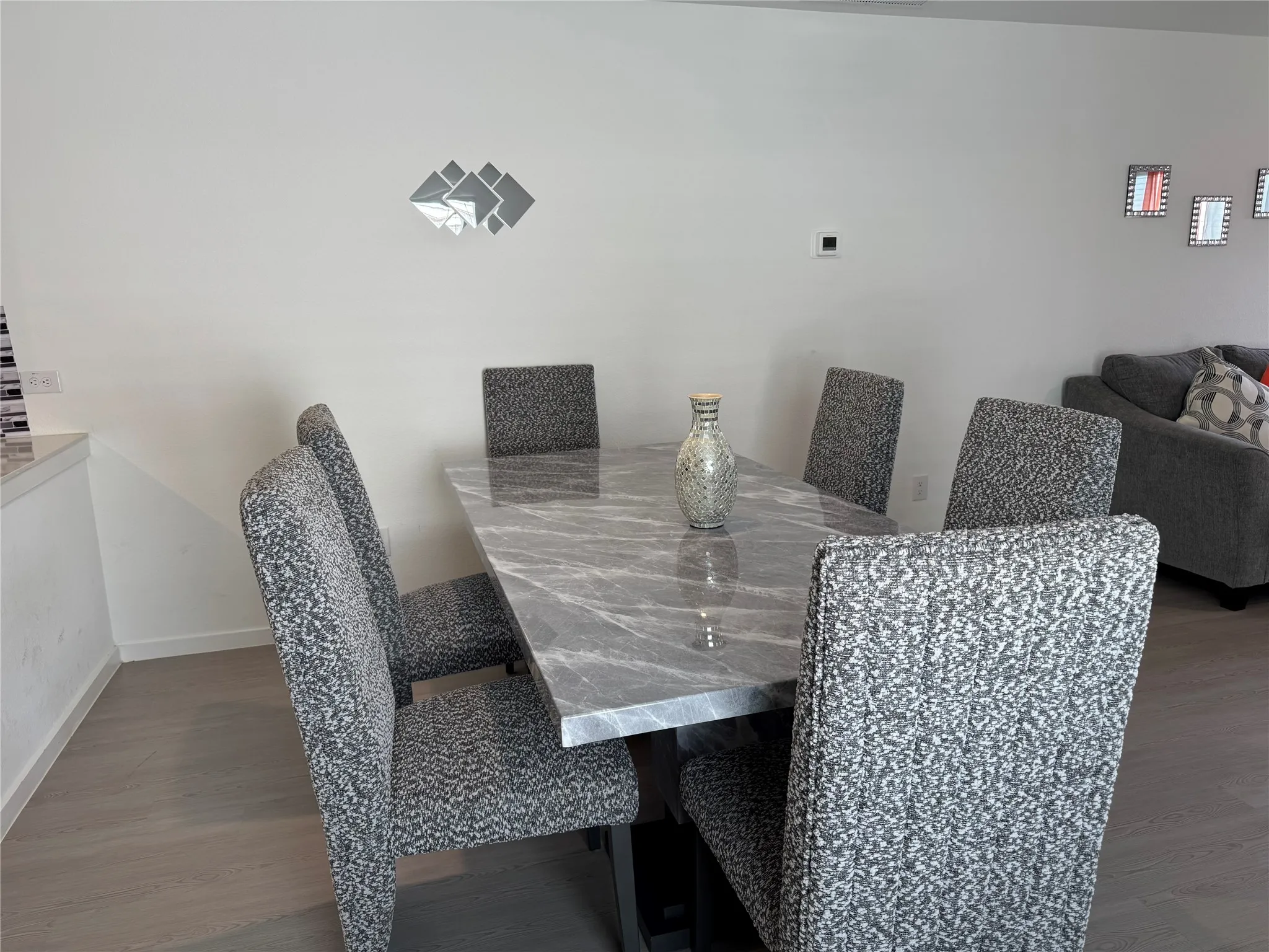 Dining area featuring a rectangular tabletop with a polished finish