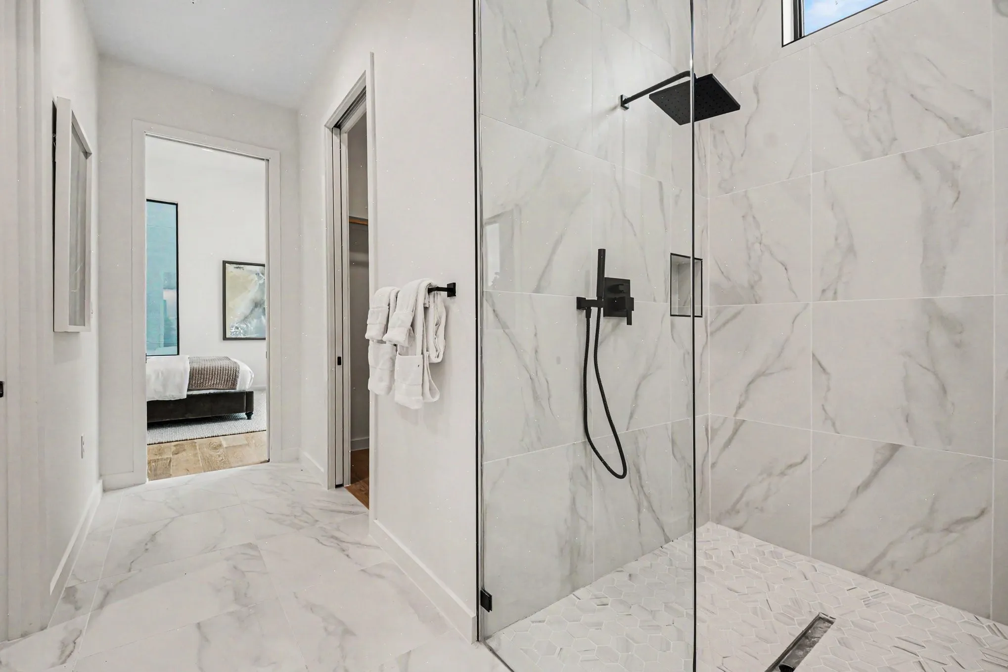 Hotel vibes in the luxurious ensuite with a combination wet-room and large walk-in closet.