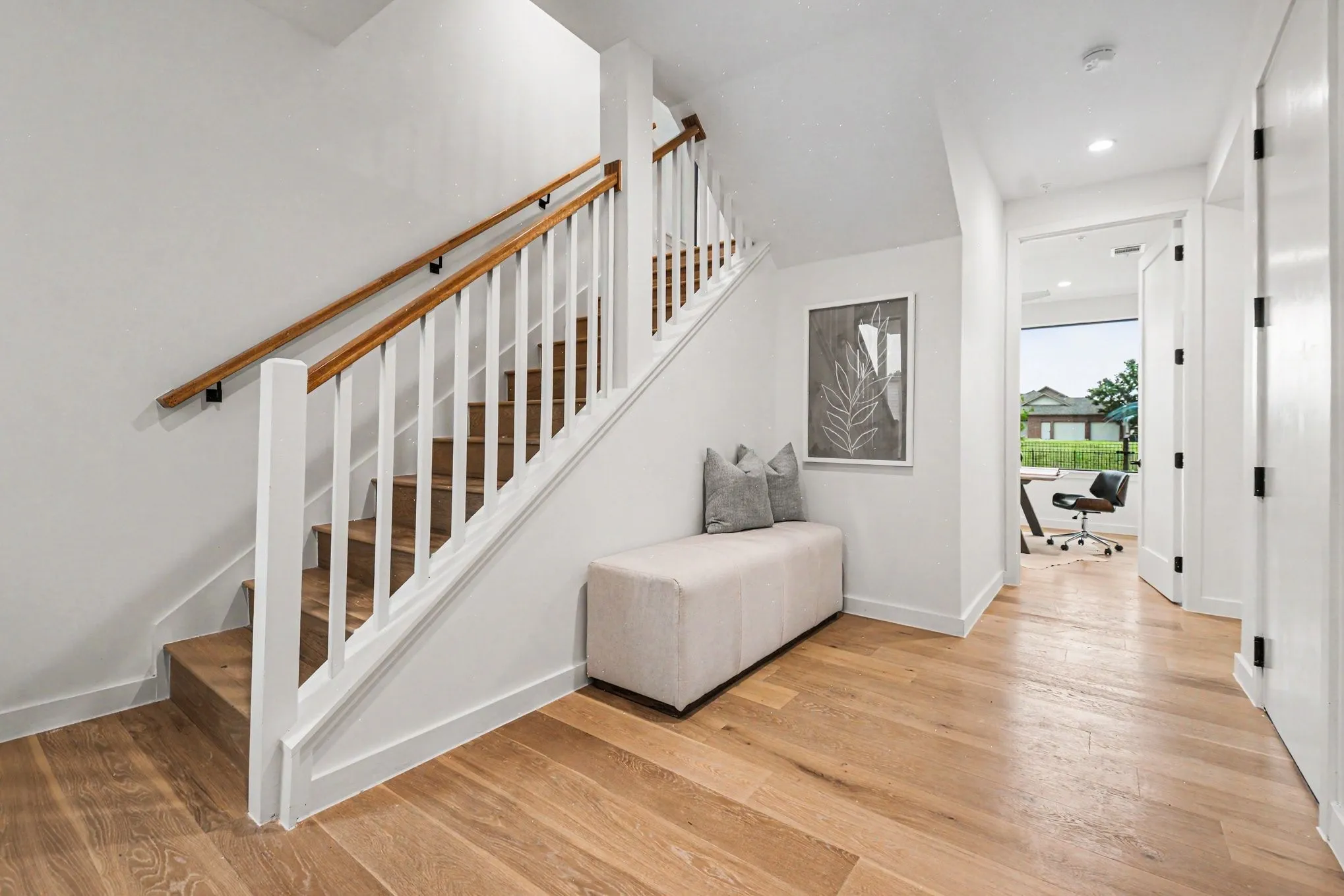 Entry with stairs leading to main floor living or 2 bedrooms, one bathroom downstairs.