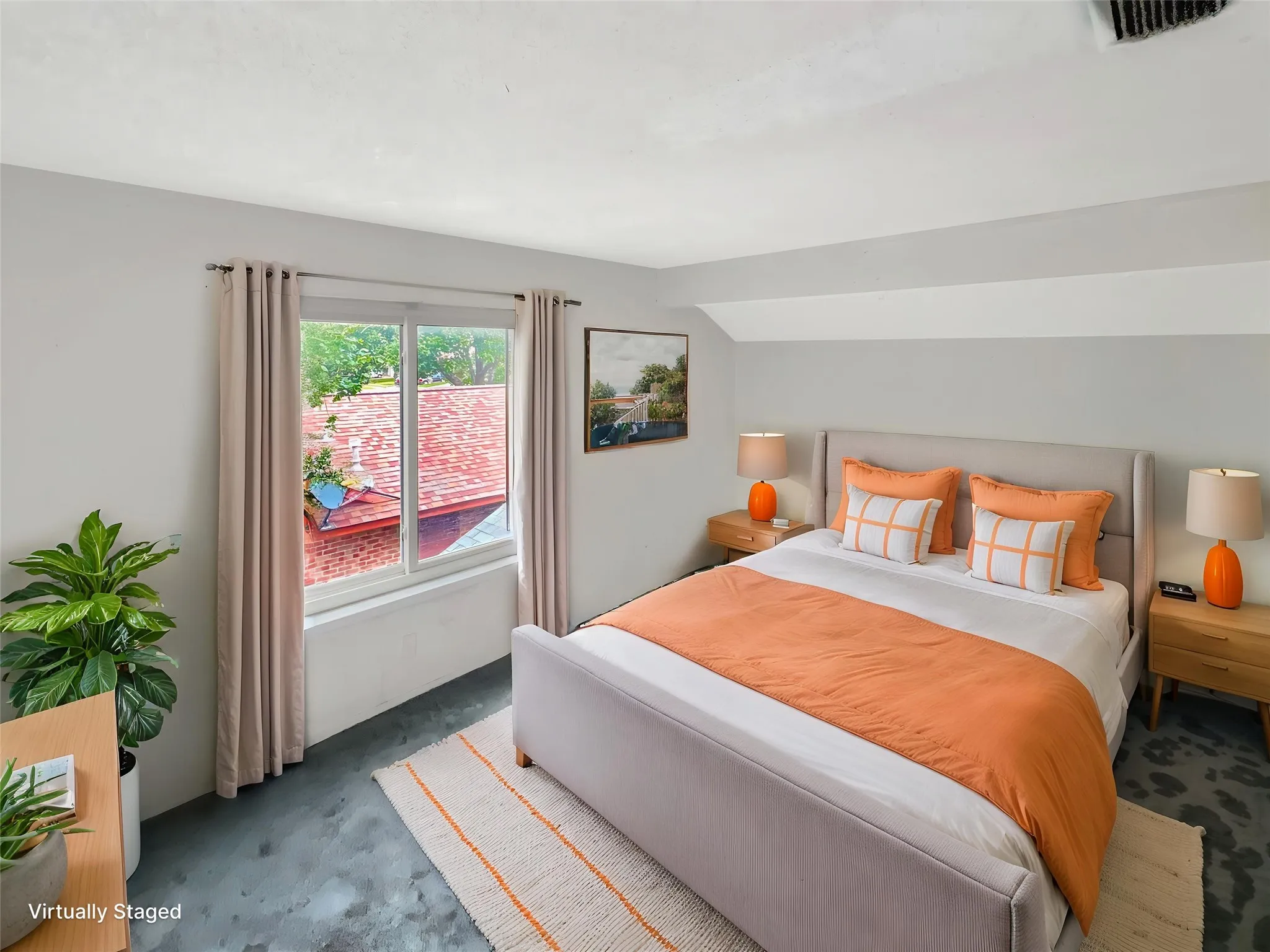 Bedroom featuring a window with natural light, sloped ceiling, and dark-toned flooring
