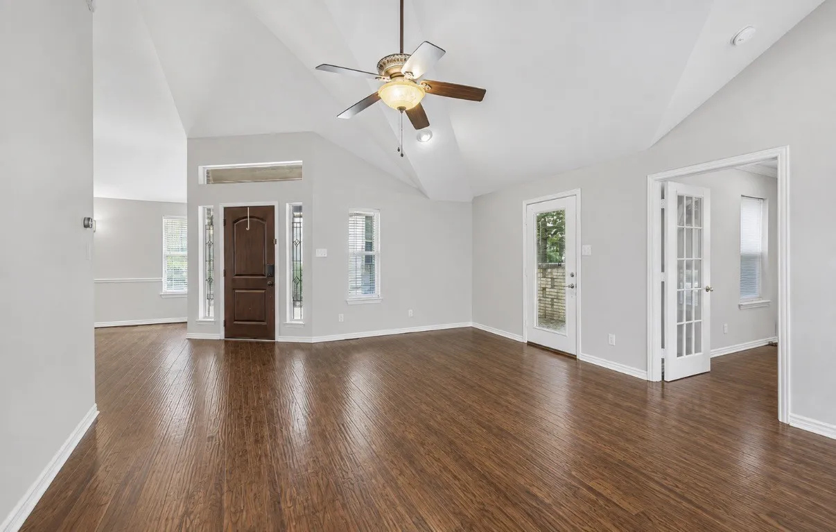 Living area show front entrance. The room to the right is that small 4th bedroom / flex room