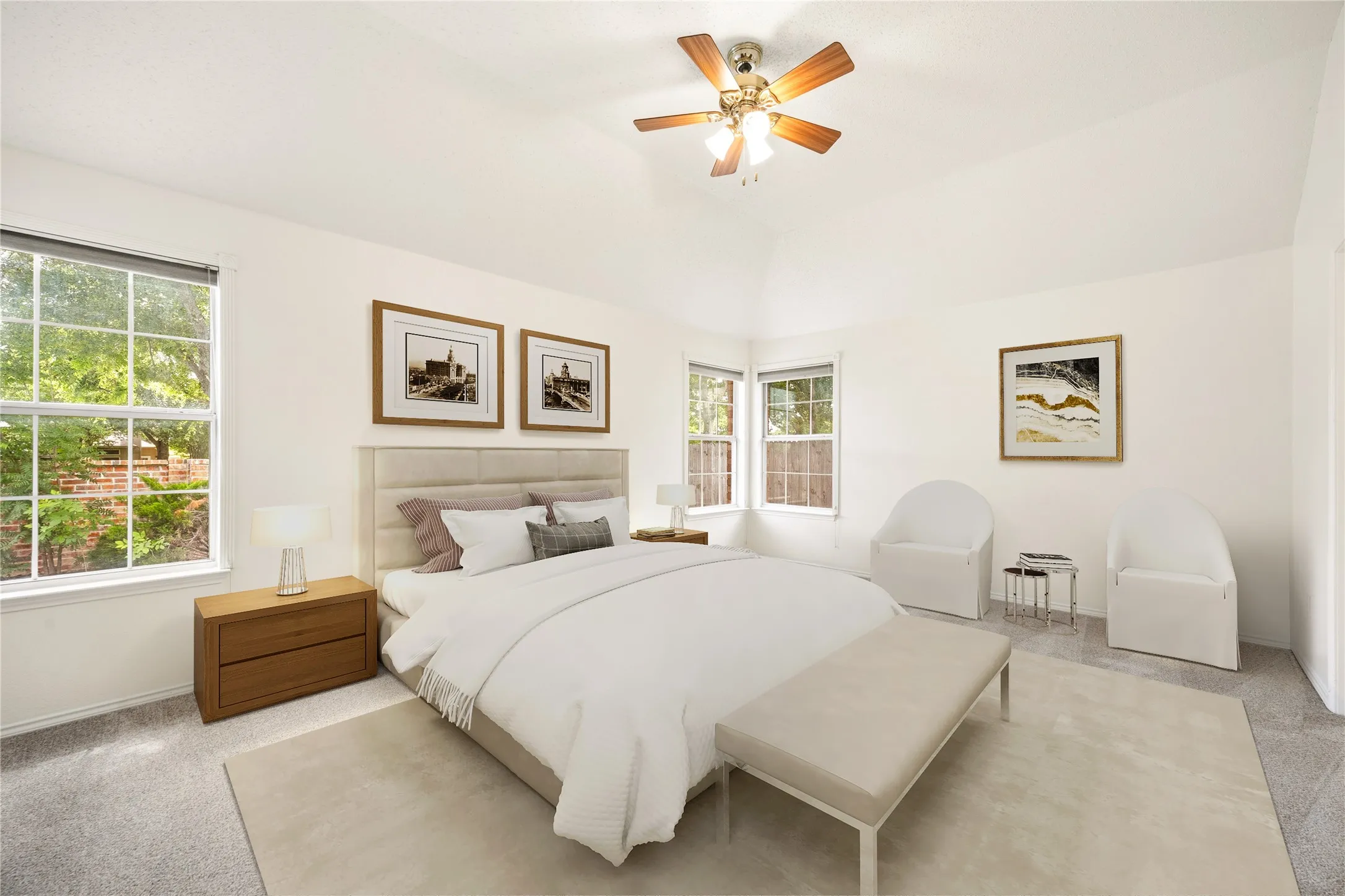 Vaulted ceiling bedroom with carpeting and a wood-finish ceiling fan