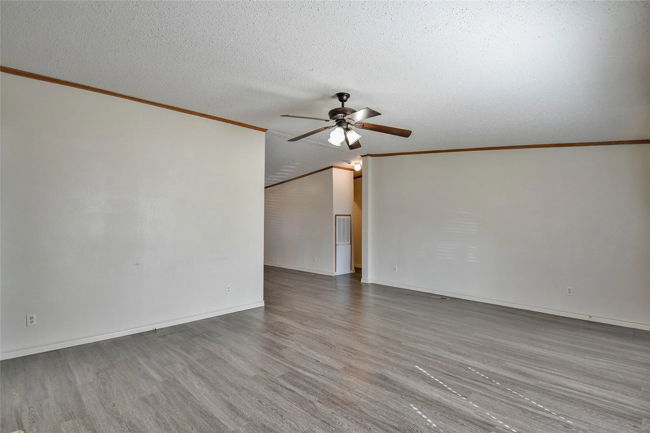 Back of living room going to the kitchen and bedrooms.