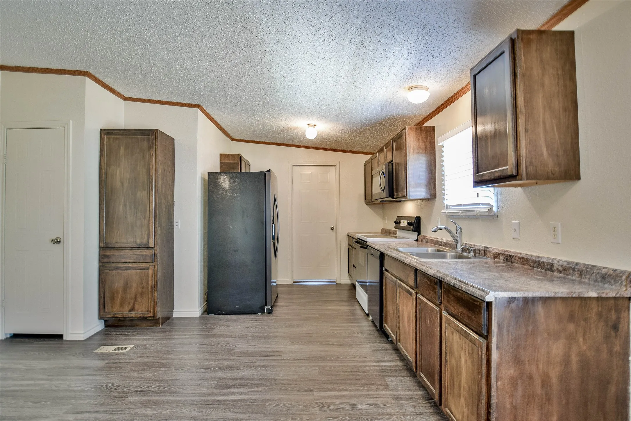 Kitchen offers plenty of storage and a great pantry.