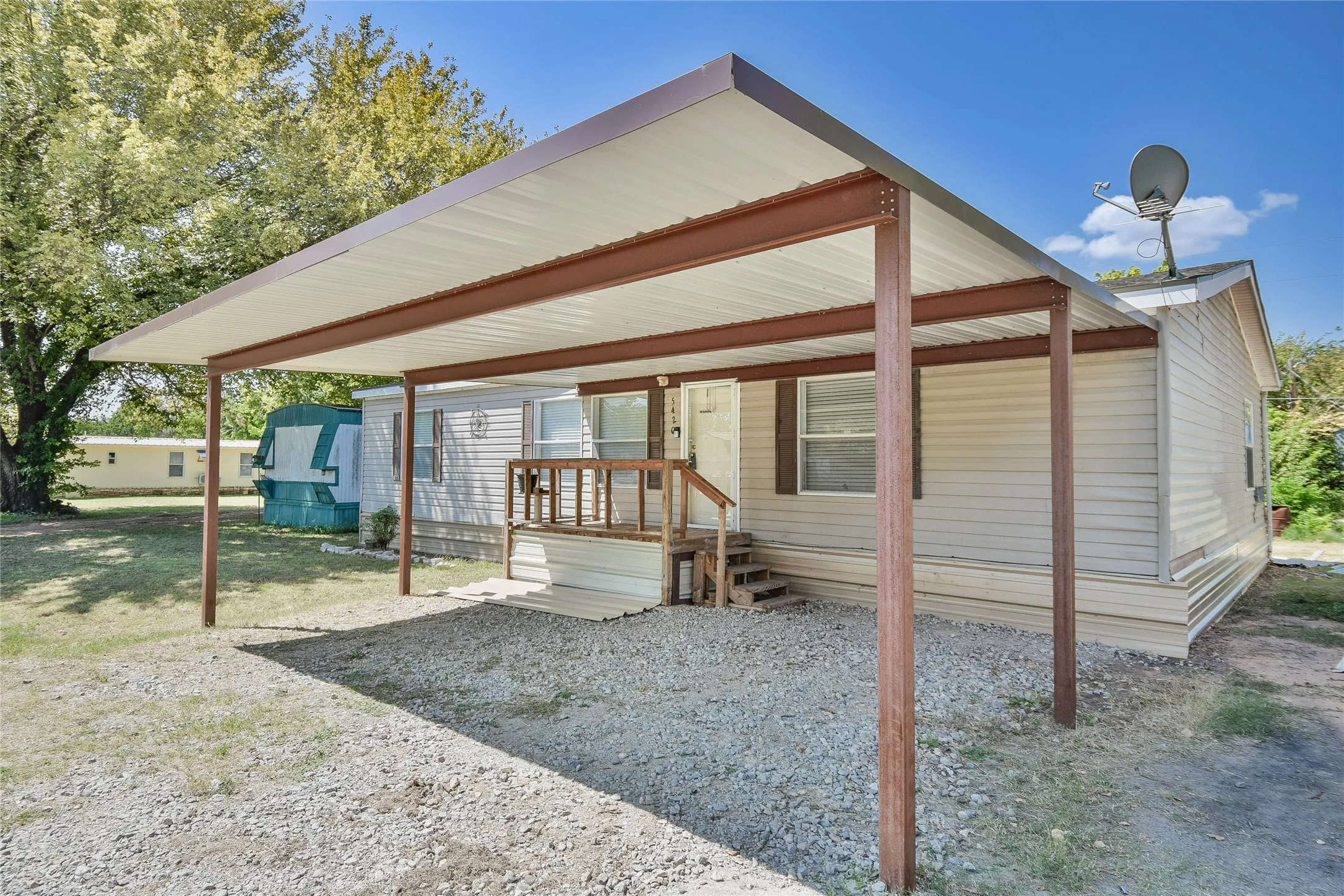 Great covered carport to keep your cars safe and sheltered!