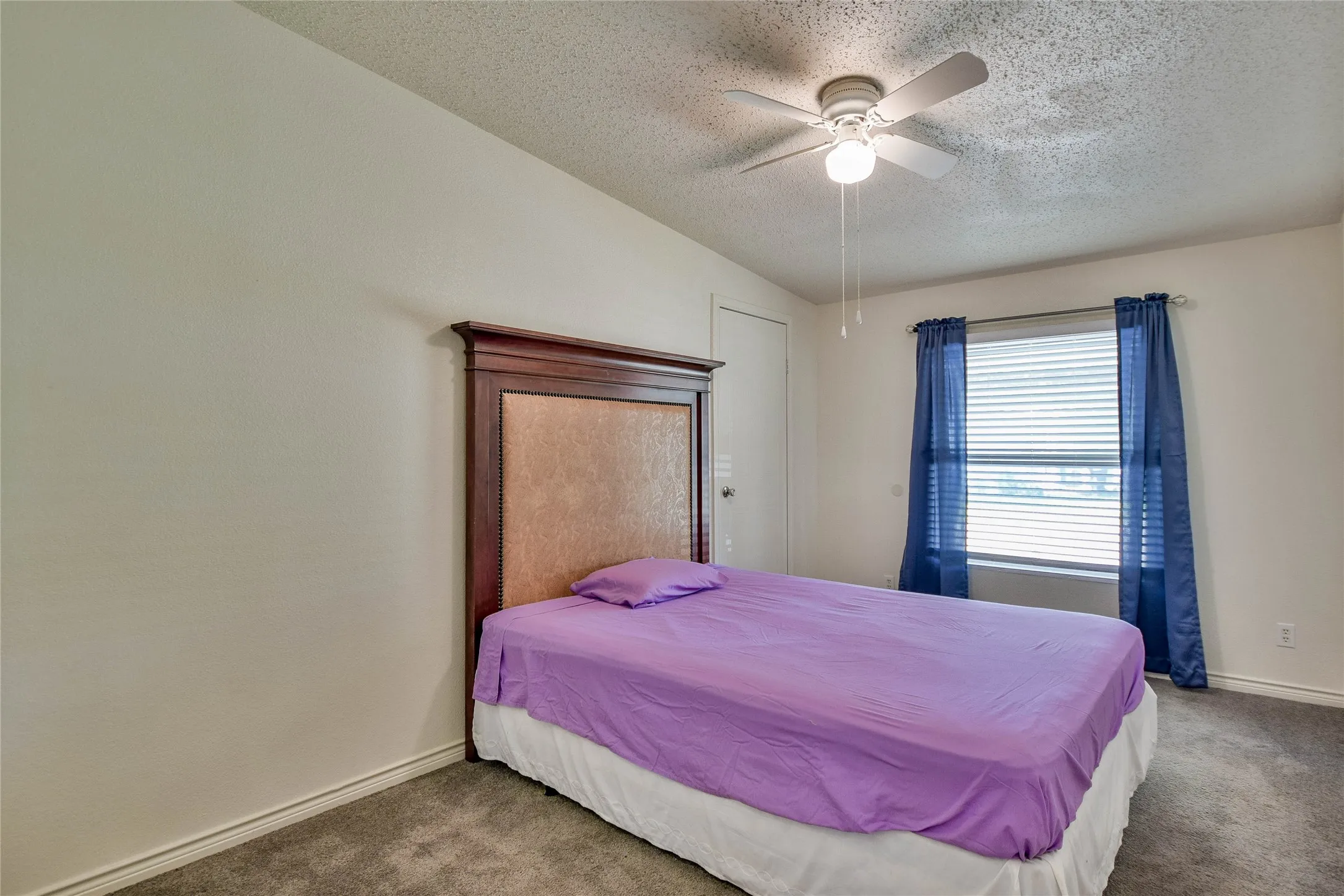 Great guest bedroom with ceiling fan.