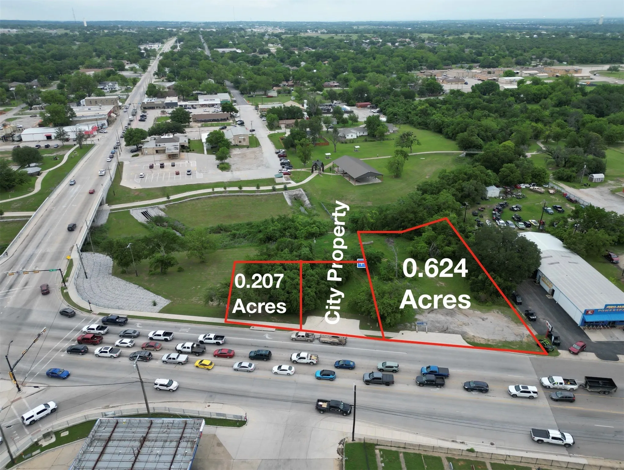 Two parcels of land totaling 0.831 acres, featuring direct road frontage and surrounded by established commercial and residential areas