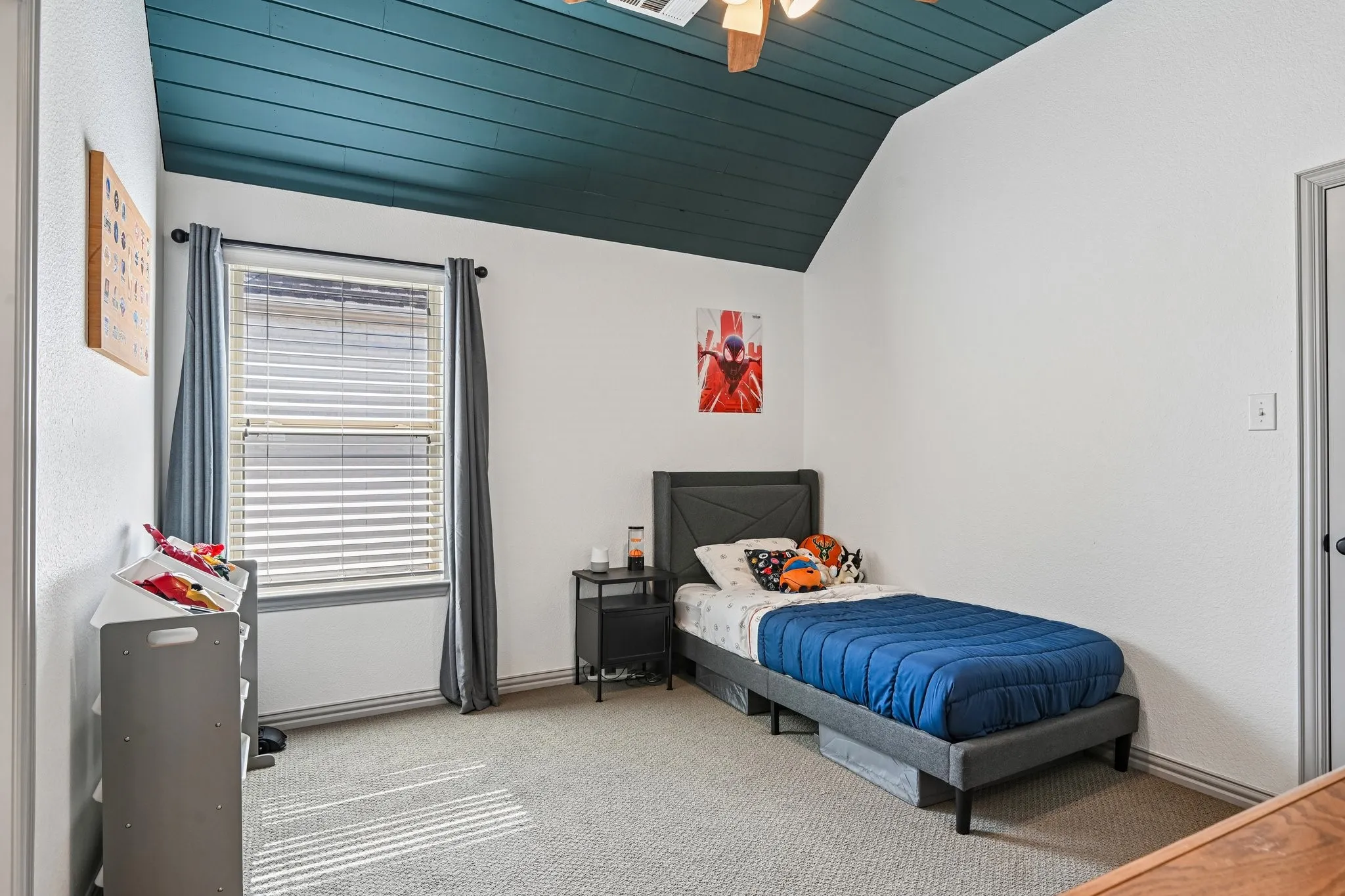 Vaulted ceiling with teal shiplap detailing