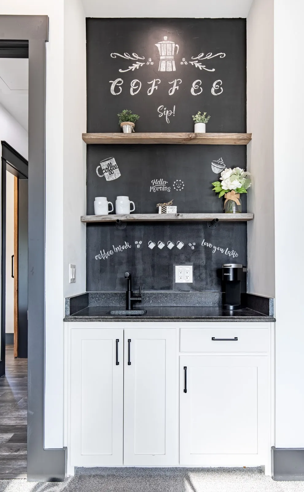 Built-in coffee bar in primary suite with wet bar and cabinets