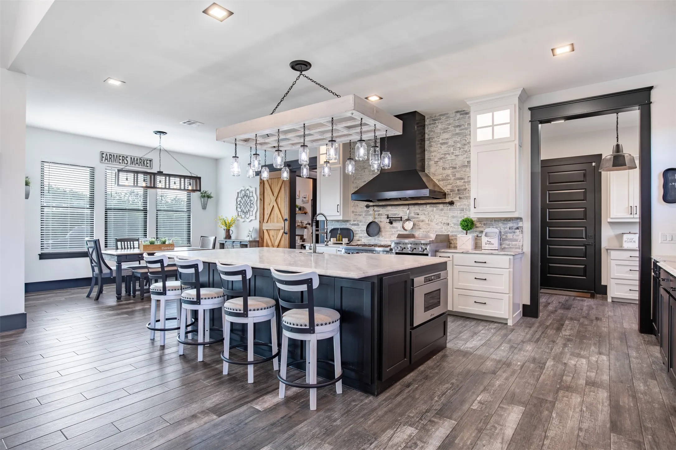 Enjoy ample seating at the island bar or in nearby breakfast nook and formal dining areas. Built-in Kitchenaid appliance home.
