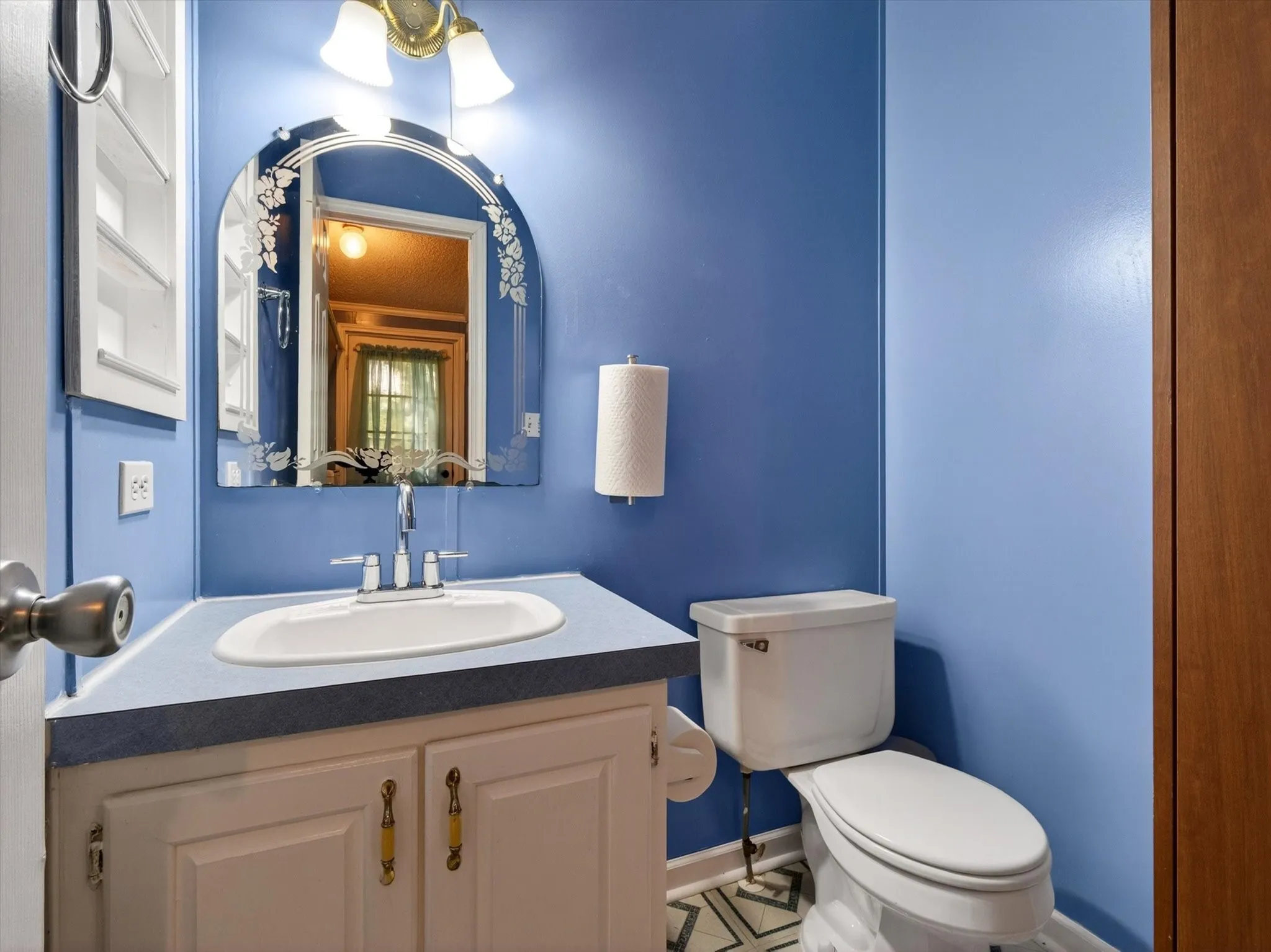 Half bathroom off the utility laundry room