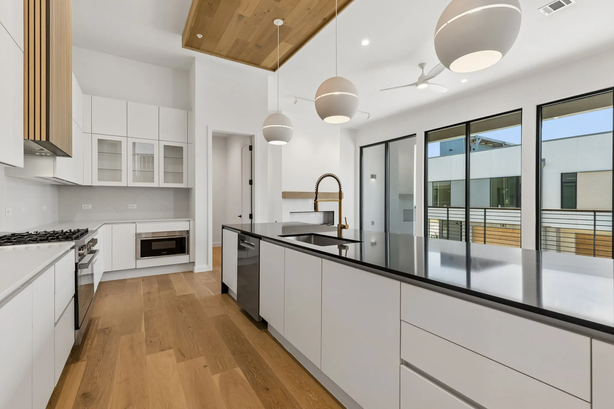 Kitchen has Bosch appliances and walk-in pantry.