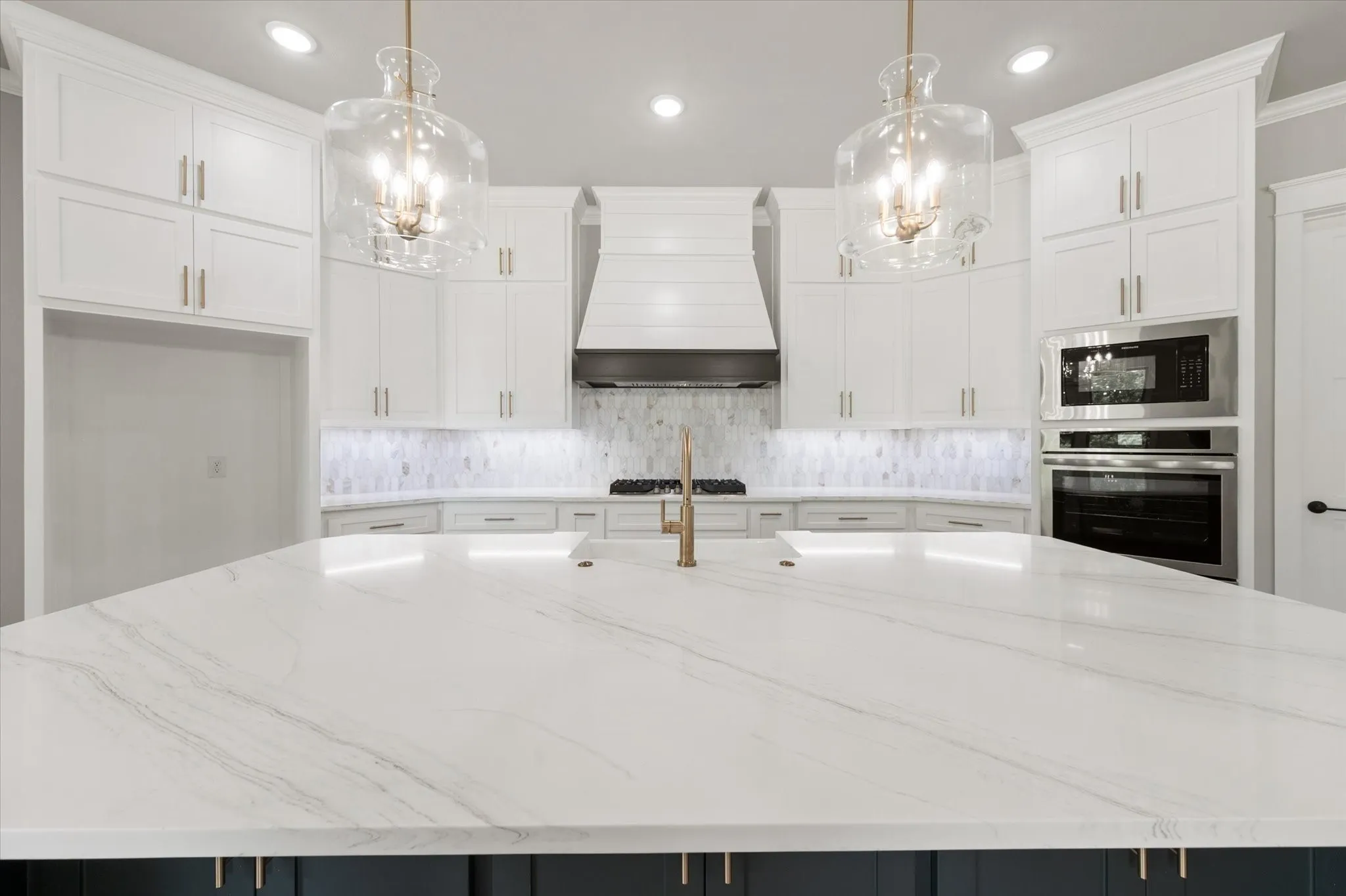 Kitchen island with a quartz countertop and integrated sink