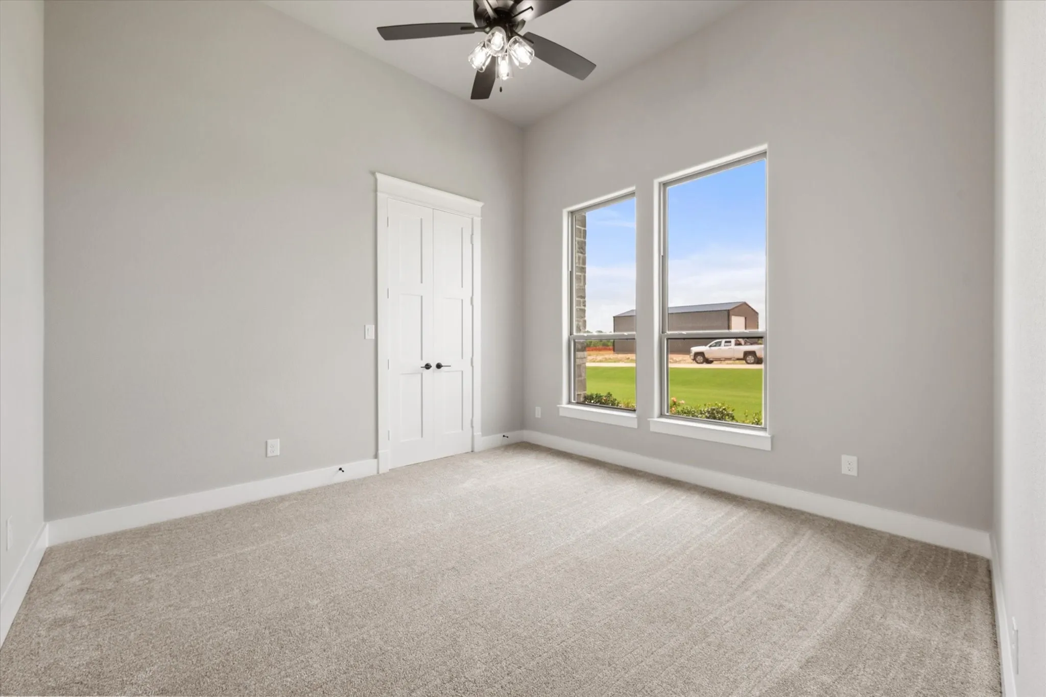 Room with vaulted ceiling and light gray walls