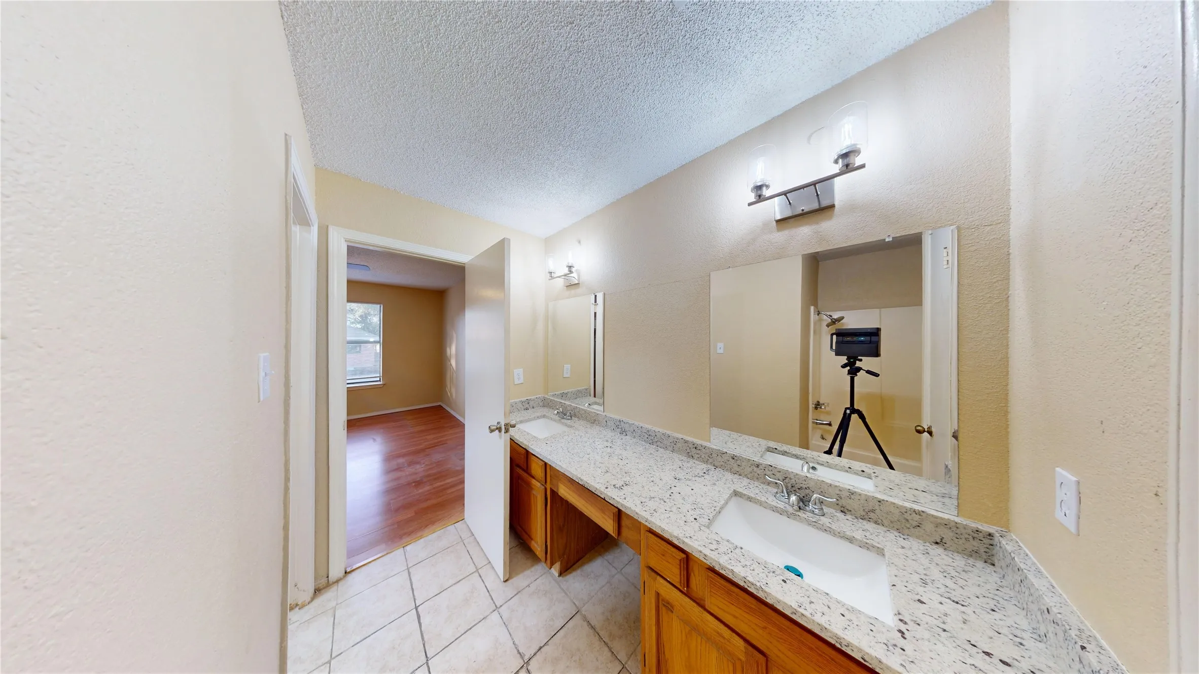 Dual vanity with granite-style countertops and integrated sinks