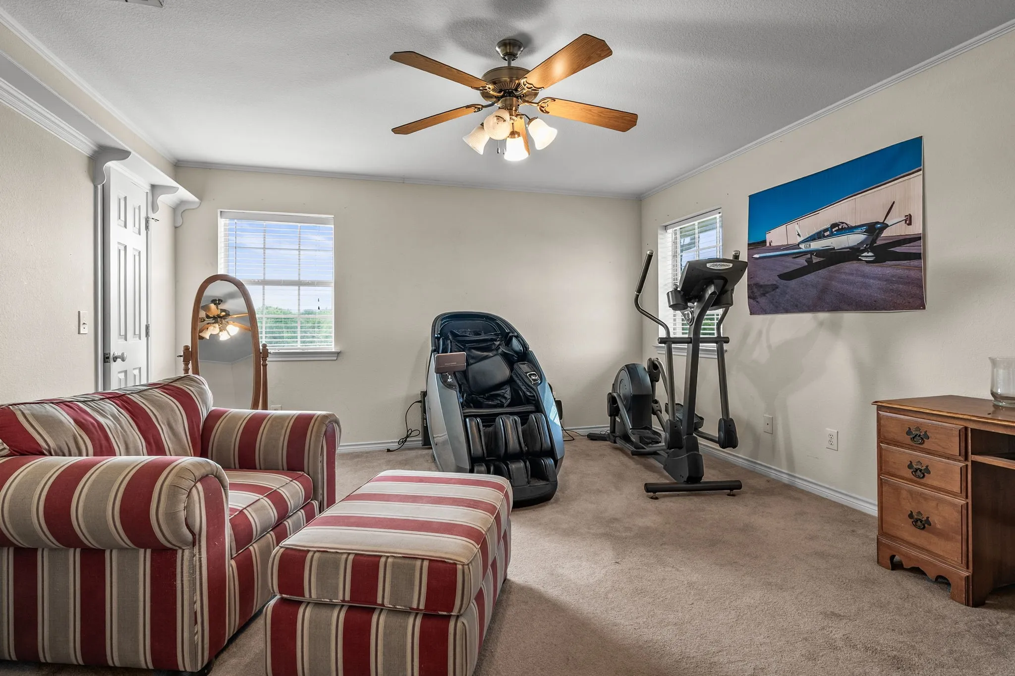 Secondary bedroom upstairs overlooking the side yard.