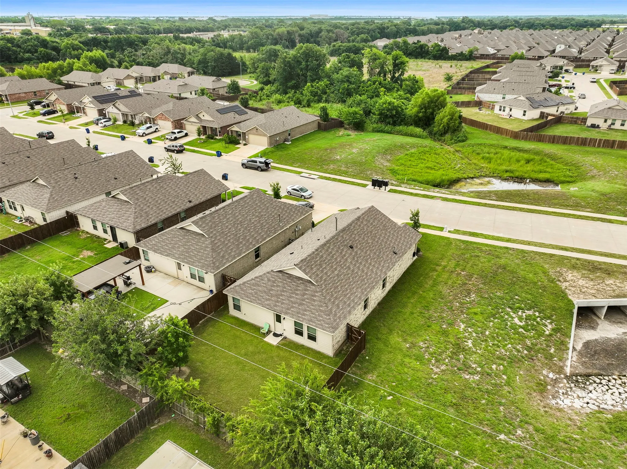 Aerial perspective showcasing the residential neighborhood with multiple homes